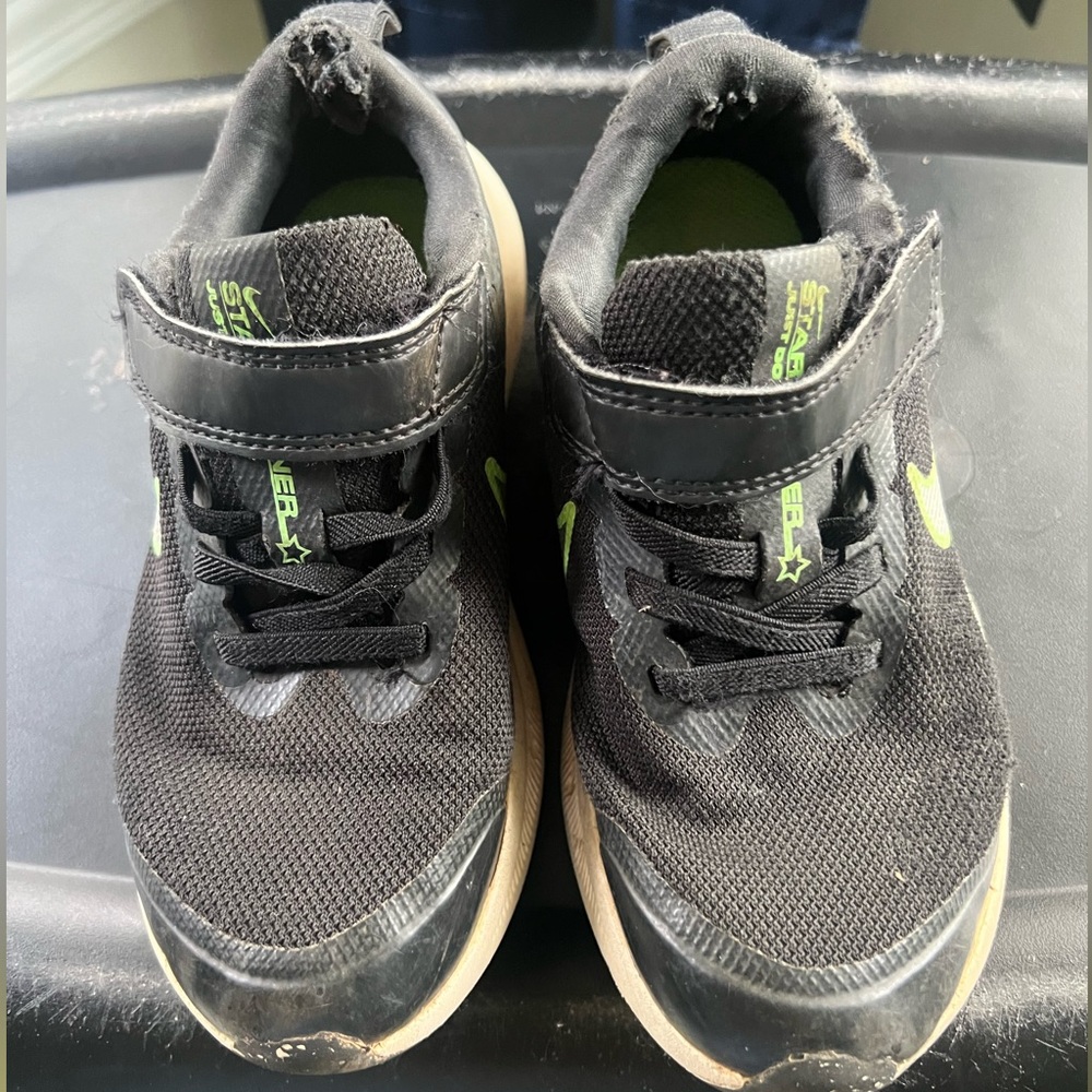 Toddler boys Nike tennis shoes size 12.5c. Worn but soles are like new.